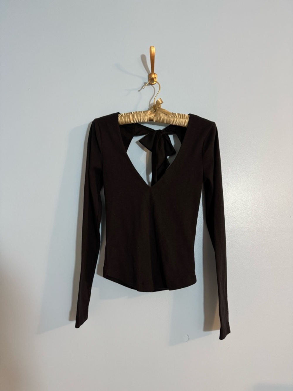 Free people black longsleeve with cut out and bow detail size XS